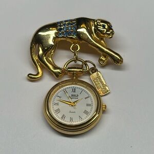 Vintage gold cat brooch with dangle watch face blue rhinestone details